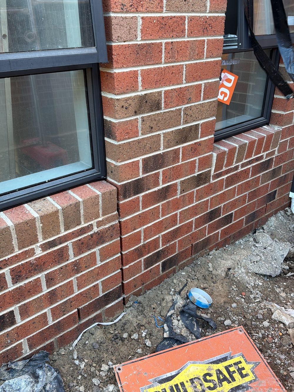 Rubber window flashings displaced from their seat against the cladding, found during a fixing inspection in Officer