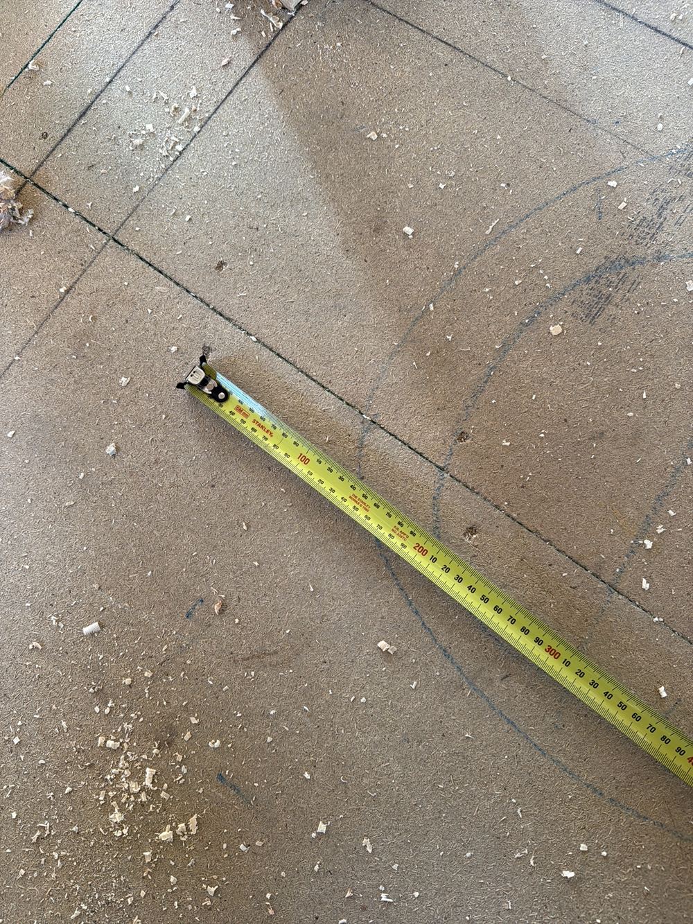 Upper floor sheeting fixed at wider spacings than the installation standard permits, Officer