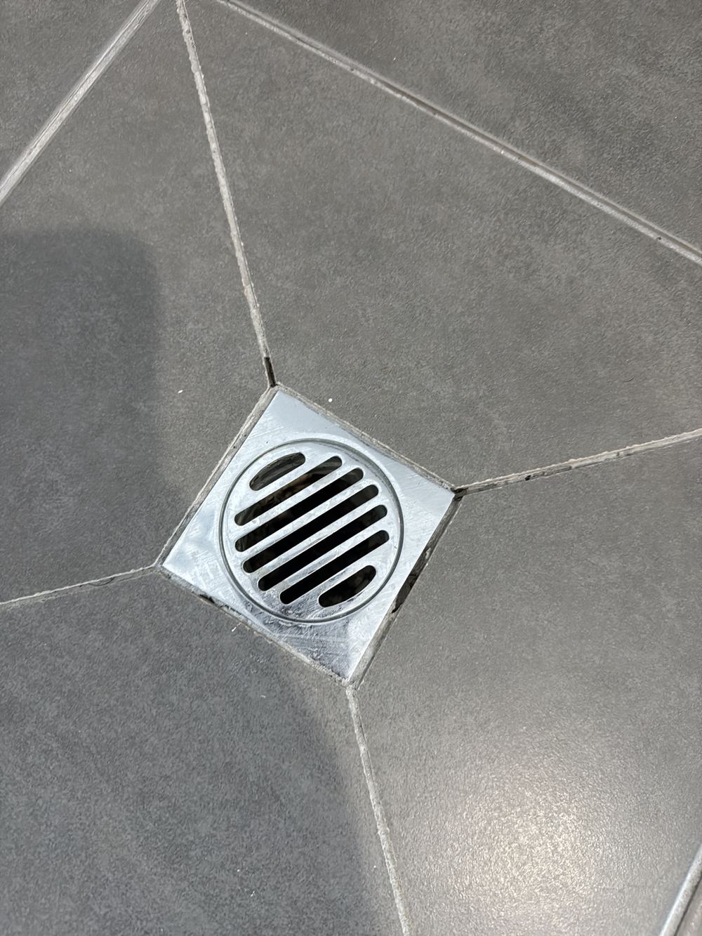 Degraded grout in the shower recess letting water through to the membrane, found during a pre-purchase inspection in Officer