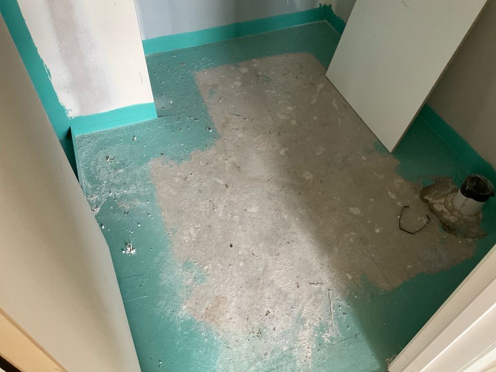 Membrane not yet applied in every wet area, and tiling has to wait for it, found during a waterproofing inspection in Officer